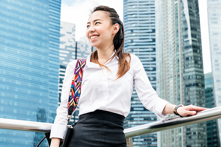 Woman in front of Singapore skyscrapers