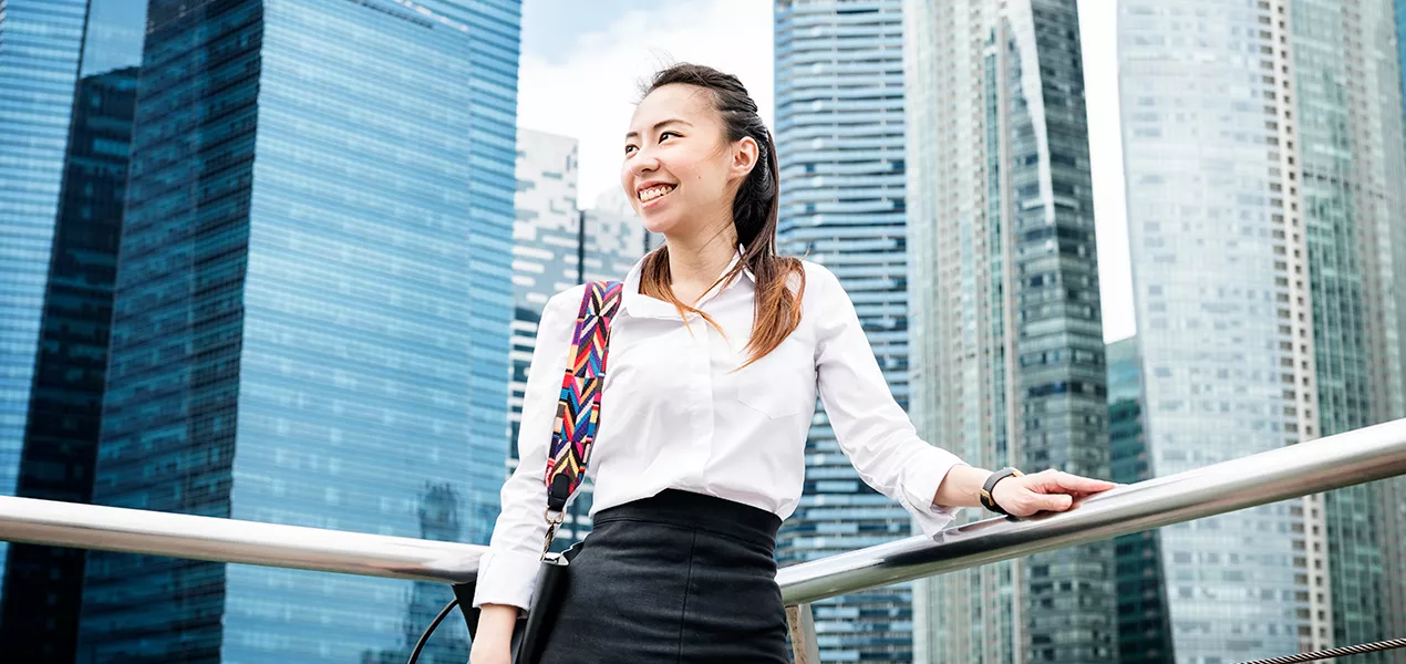 Woman in front of Singapore skyscrapers